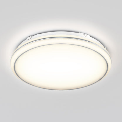 A round, flush-mounted ceiling light fixture emitting a bright, even glow against a plain white ceiling.