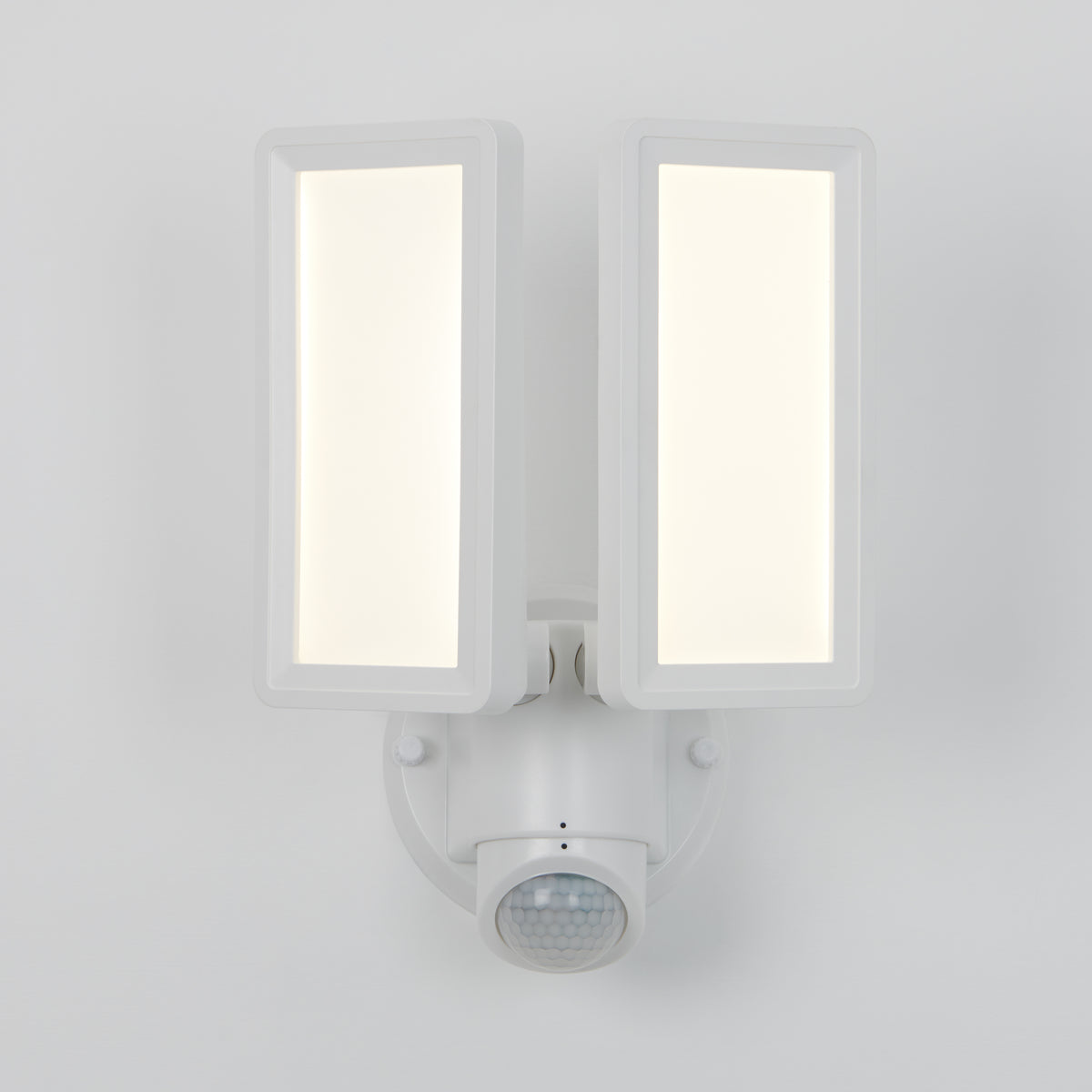 The Artika Sentinel Outdoor Flat Panel Security Light is a modern white LED fixture with dual rectangular panels and a motion sensor, shown mounted on a plain white wall.