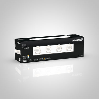 A black rectangular box showcases the Oracle LED bathroom vanity light by Artika, featuring images of the chrome fixture with clear glass shades and product details on its sides.