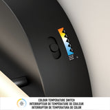 Close-up of a color temperature switch on a black device, showing a slider with a gradient scale from warm yellow to cool blue and labeled settings. Text below reads Colour Temperature Switch in English, French, and Spanish.
