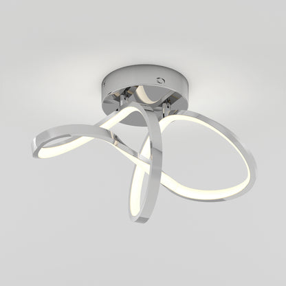 Modern ceiling light fixture with three curved LED light loops and a shiny chrome base, mounted on a white ceiling, emitting soft white light.