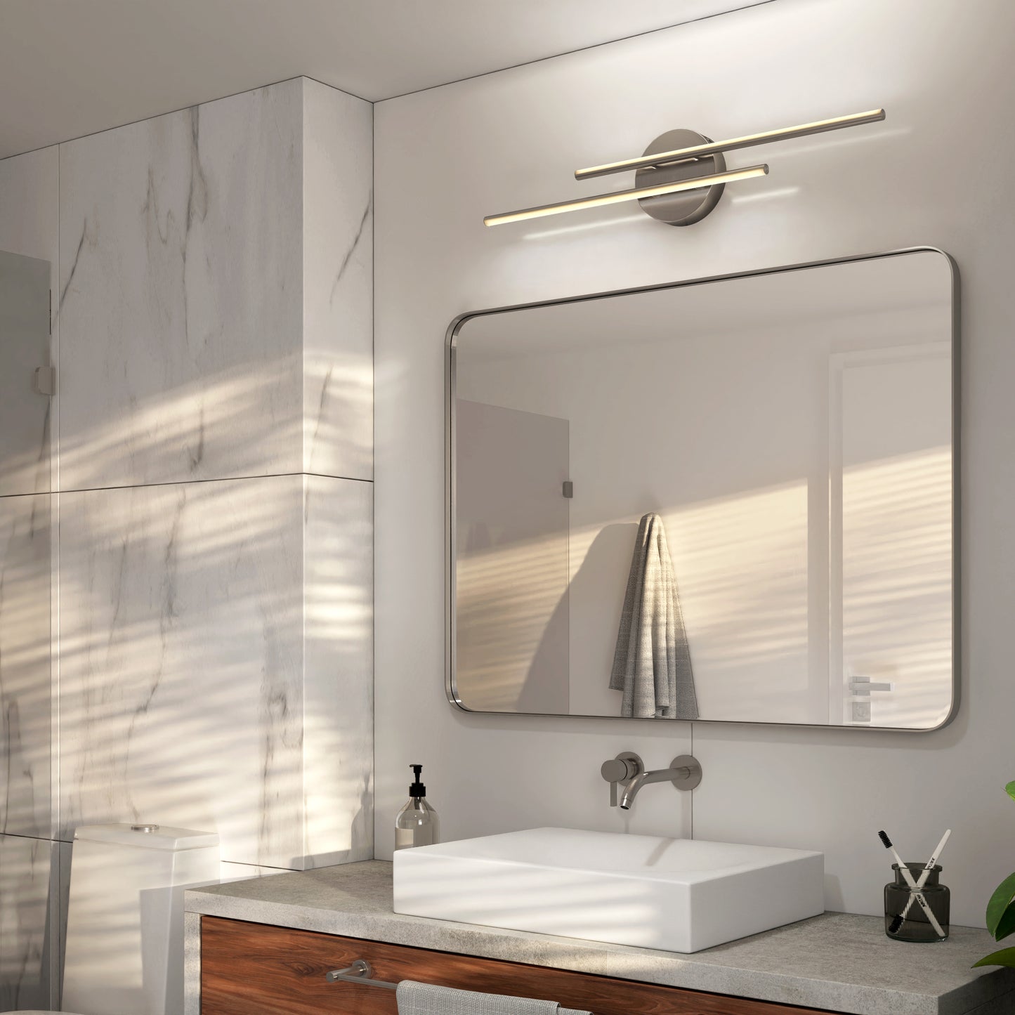 A modern bathroom features marble walls, a large mirror, square white sink, wall-mounted faucet, wooden vanity, soap dispenser, towel on the wall, and is illuminated by the Artika Cisco modern LED bathroom vanity light 5 CCT.