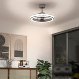 Modern living room with a stylish circular ceiling fan light, abstract wall art, a glass sliding door, a potted plant, a chair, and a wooden sideboard with decorative items.