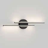 A modern wall sconce with a black circular base and two parallel horizontal light bars extending outward, emitting soft white light against a plain light gray wall.