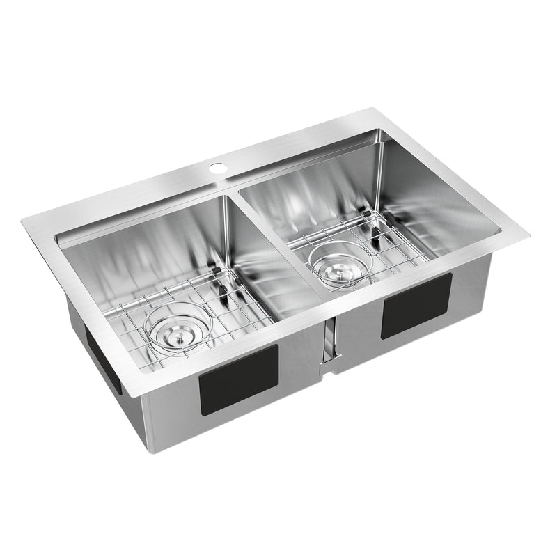 The Artika Newport double bowl stainless steel sink features a single faucet hole and includes metal grid racks for each basin.