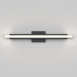 A modern wall-mounted LED light fixture with a long horizontal bar emitting white light, attached to a central rectangular black base on a plain light gray wall.