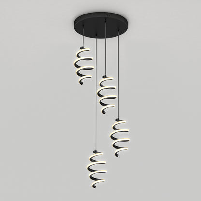 The Artika Chorus 4 light LED pendant features three spiral-shaped lights hanging from a round black base, emitting a soft white glow. Its modern design complements any space with adjustable color temperatures (5 CCT).