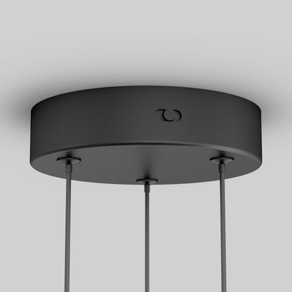 Close-up of the Artika Orly modern LED pendant light 5 CCT’s matte black canopy with three hanging cables, set against a plain light gray background.