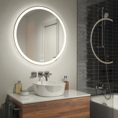 A modern bathroom features the Artika Mateo 28 in. LED mirror with defogger above a white sink on a wooden vanity, gray tiled walls, and a glass-door shower with circular fixture next to the bathtub.