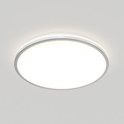 The Artika Macy 15 in. LED modern flush mount light features a white frosted cover and emits bright, even illumination against a light-gray ceiling. This RGB WiFi fixture combines modern style with advanced smart lighting control.