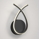A modern wall light fixture with a black circular base and two curved LED light strips forming an intersecting loop shape, mounted on a white wall.