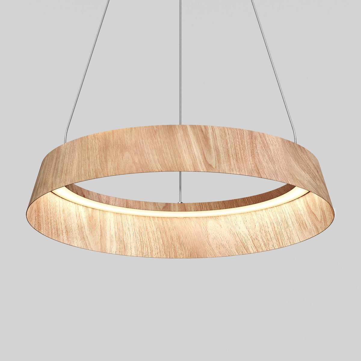A modern circular pendant light fixture with a wood finish, suspended by thin wires against a plain gray background. The inner edge of the ring emits a soft, even light.