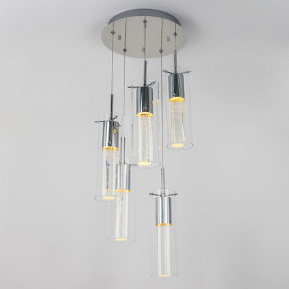The Artika Essence 5-light LED pendant features five cylindrical glass shades suspended at varying heights from a round metallic base, each illuminated with an energy-efficient LED.