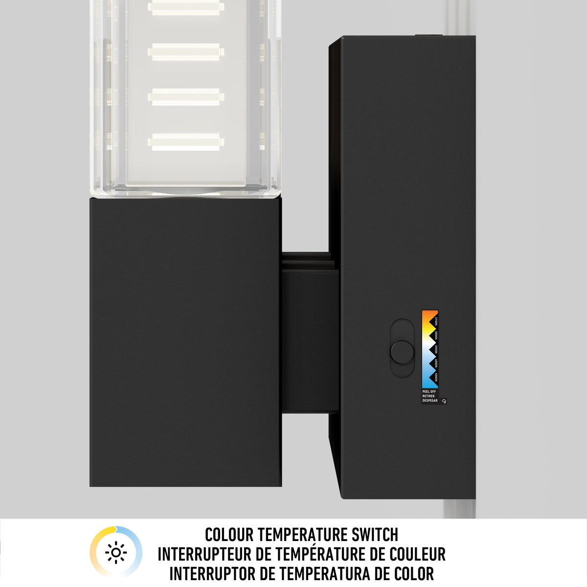 A close-up of a black colour temperature switch with a sliding control and colour temperature scale, mounted on a wall. Below, a label reads “COLOUR TEMPERATURE SWITCH” in English, French, and Spanish.