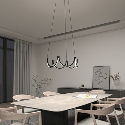 Modern dining room with six light wood chairs around a rectangular table, highlighted by the Artika Adelia LED pendant light 5 CCT, large window with sheer curtains, minimalist decor with wall art and a small plant.