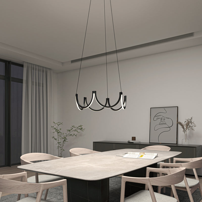 Modern dining room with six light wood chairs around a rectangular table, highlighted by the Artika Adelia LED pendant light 5 CCT, large window with sheer curtains, minimalist decor with wall art and a small plant.