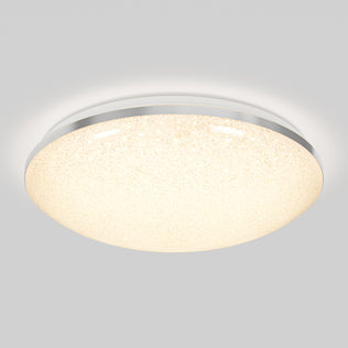 The Artika Sparkle 15 in. LED modern flush mount light features a textured, glowing white surface and a slim metallic rim, creating a stylish look on any ceiling with adjustable 5 CCT color temperatures.