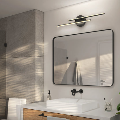 Modern bathroom featuring the Artika Cisco modern LED bathroom vanity light 5 CCT, a rectangular mirror, black wall-mounted faucet, vessel sink, soap dispenser, wooden vanity, and concrete wall tiles. Sunlight casts shadows near a towel by the door.