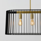 A modern pendant light fixture with a rectangular black metal cage frame, gold sockets, and two exposed lightbulbs hanging against a plain white background.