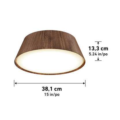 The Artika Dunham 15 in. LED flush mount light features a round, wood-textured exterior and measures 38.1 cm (15 in) in diameter by 13.3 cm (5.24 in) high; measurement arrows and labels are shown.