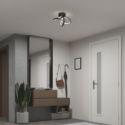 Modern hallway featuring the Artika Loop modern LED flush mount light (3 CCT), a wall mirror, floating wooden shelf, potted plant, and wall-mounted hooks with bags and an umbrella near a white door.