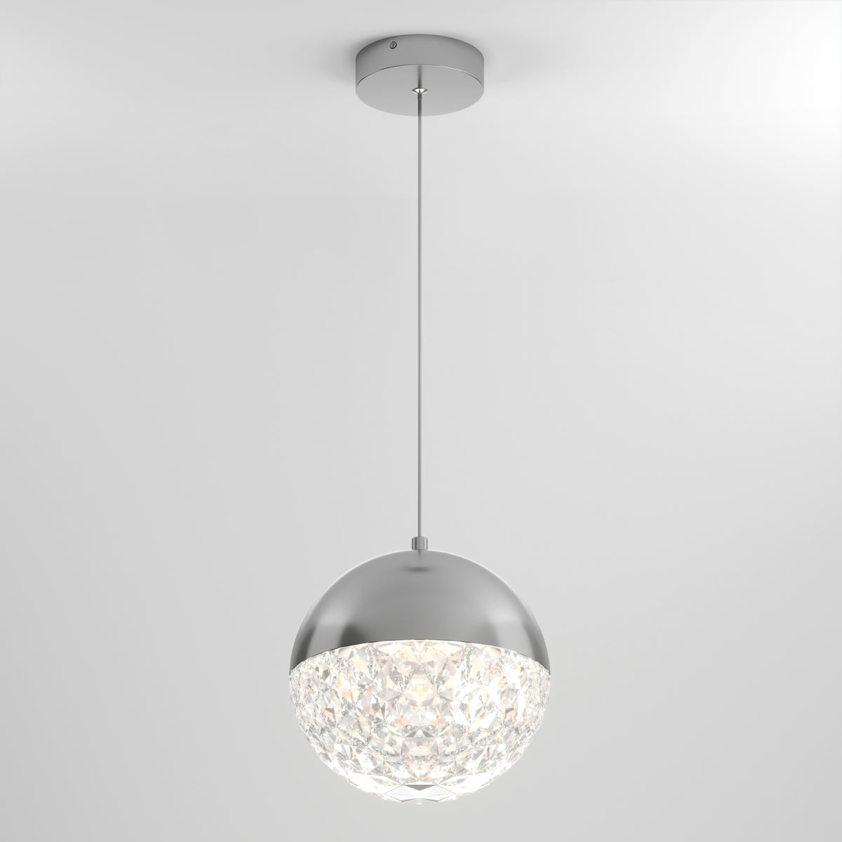 The Artika Carat LED pendant light 3 CCT features a silver metallic dome top and crystal-like textured bottom, suspended by a thin cord against a plain white background.