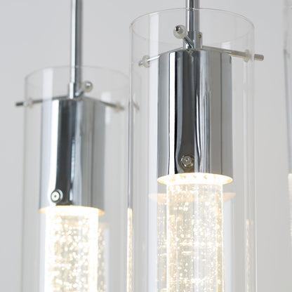 The Artika Bubble Flow 4-light pendant showcases modern cylindrical glass shades with chrome accents and illuminated textured rods inside, creating a glowing, sparkling effect.