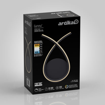 A black Artika box displays the Gamma modern LED wall sconce 5 CCT, featuring an image of its gold, loop-shaped design. The packaging highlights a 50,000-hour lifespan and 550 lumens.