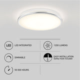 Round ceiling LED light fixture emits soft white glow. Features listed: LED integrated, 1200 lumens, dimmable, 50,000-hour lifespan, and easy installation with a safety hook included. Minimalist design on a white background.