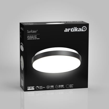 A black box displays the Artika Sunraker 10 in. LED modern flush mount light. The front shows a bright, circular fixture with features: 18W power, 1000 lumens, dimmable, and a 50,000-hour lifespan.