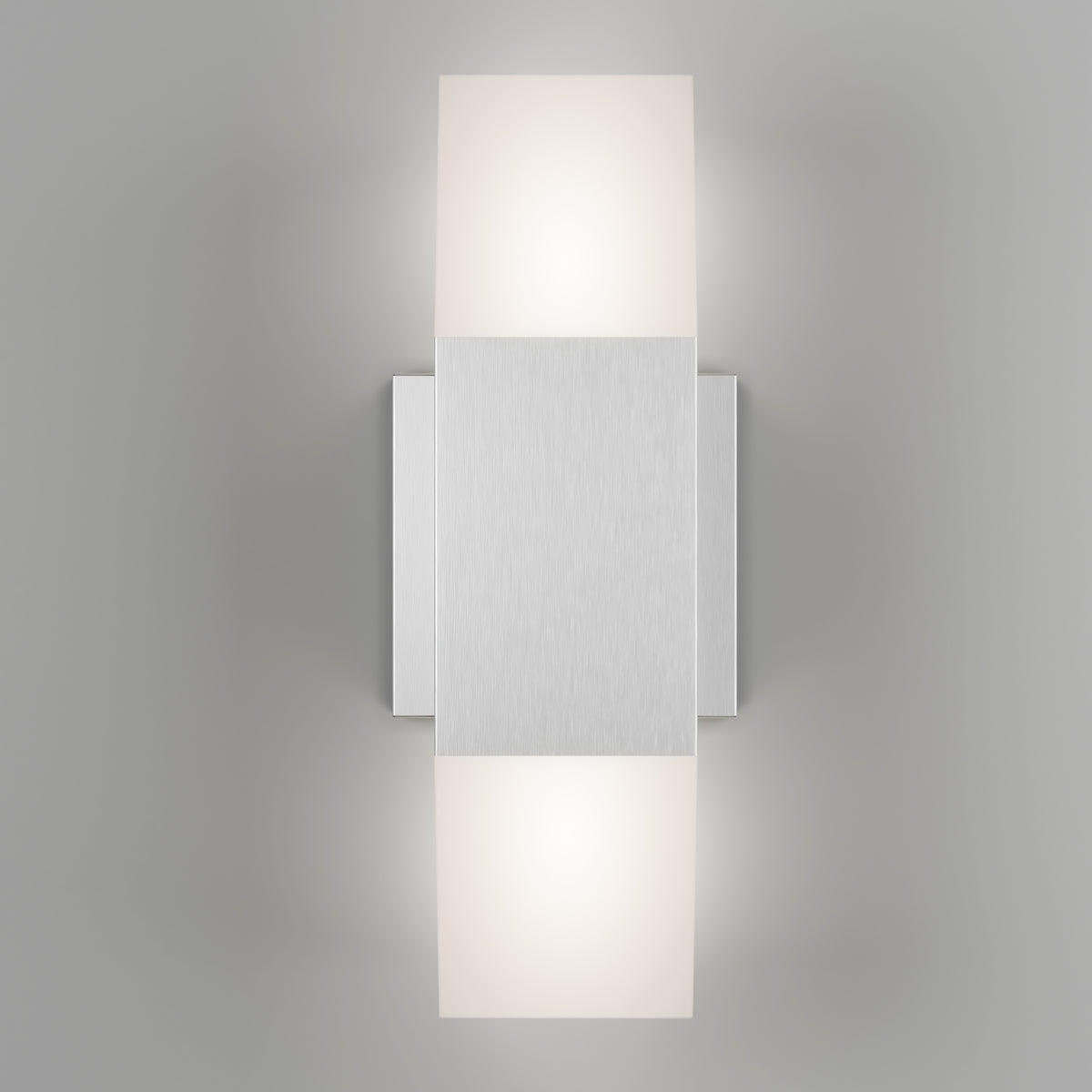 The Artika Lennox indoor-outdoor LED wall light 3 CCT features a modern brushed metal rectangular center with two frosted glass shades above and below, casting soft white light against a light gray backdrop.