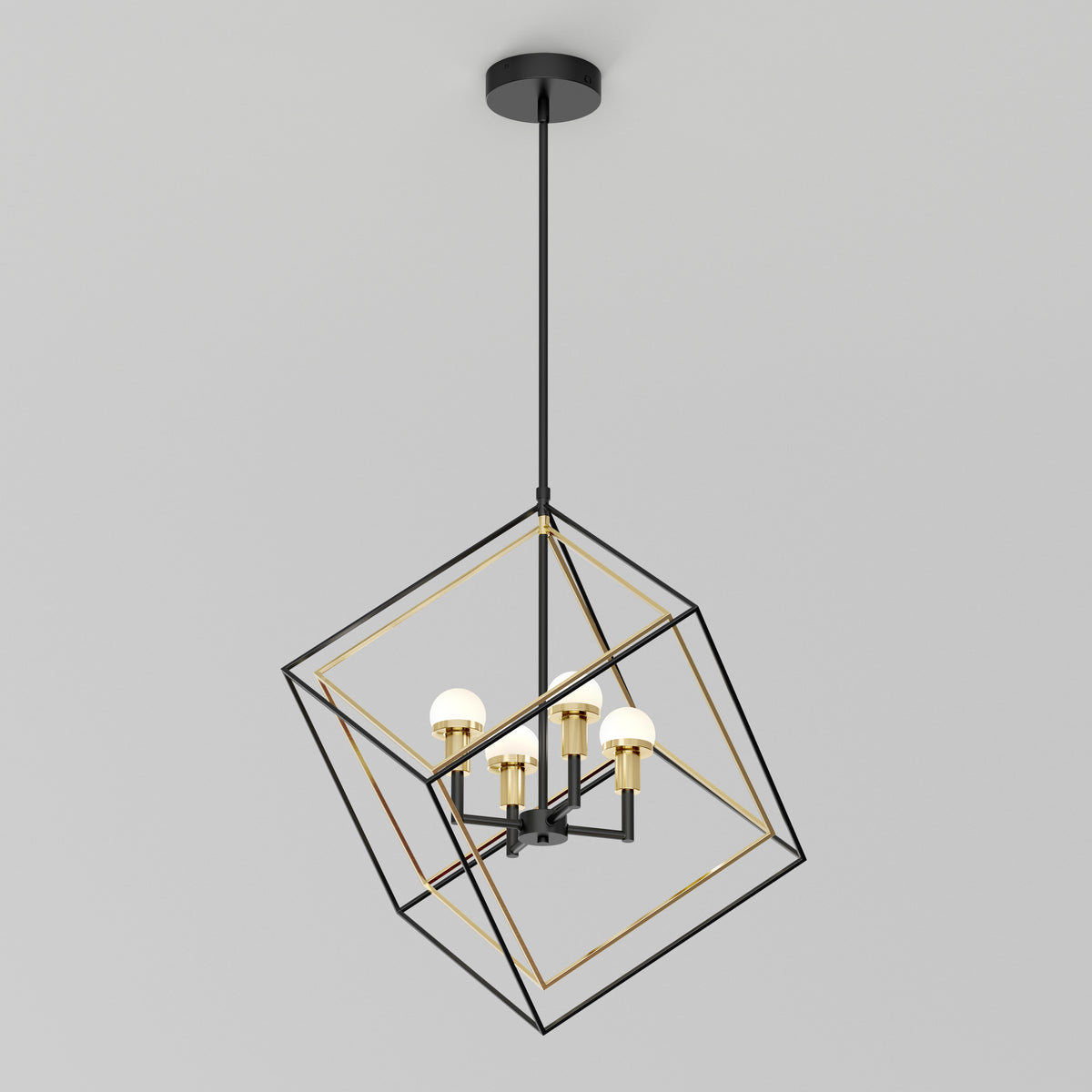 A modern pendant light with four exposed bulbs set inside a geometric, open metal cube frame suspended from the ceiling. The frame combines black and gold finishes.