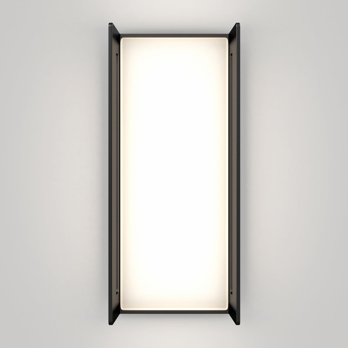 The Artika Ryker smart RGB indoor-outdoor wall light features a bright, glowing center framed by slim black side panels and is mounted on a plain light gray wall.