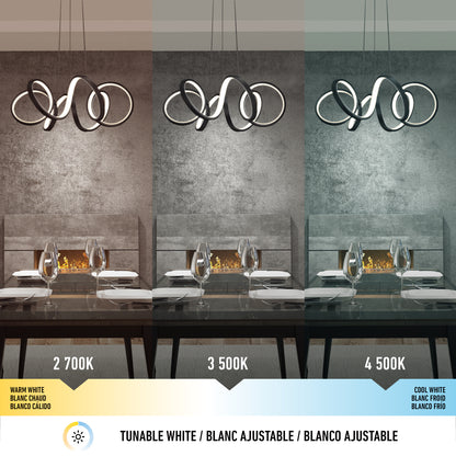 Three panels show a modern dining room lit by the Artika Swirl Ribbon LED pendant: left in warm white (2700K), center in neutral white (3500K), and right in cool white (4500K). The pendant hangs above a set dining table.