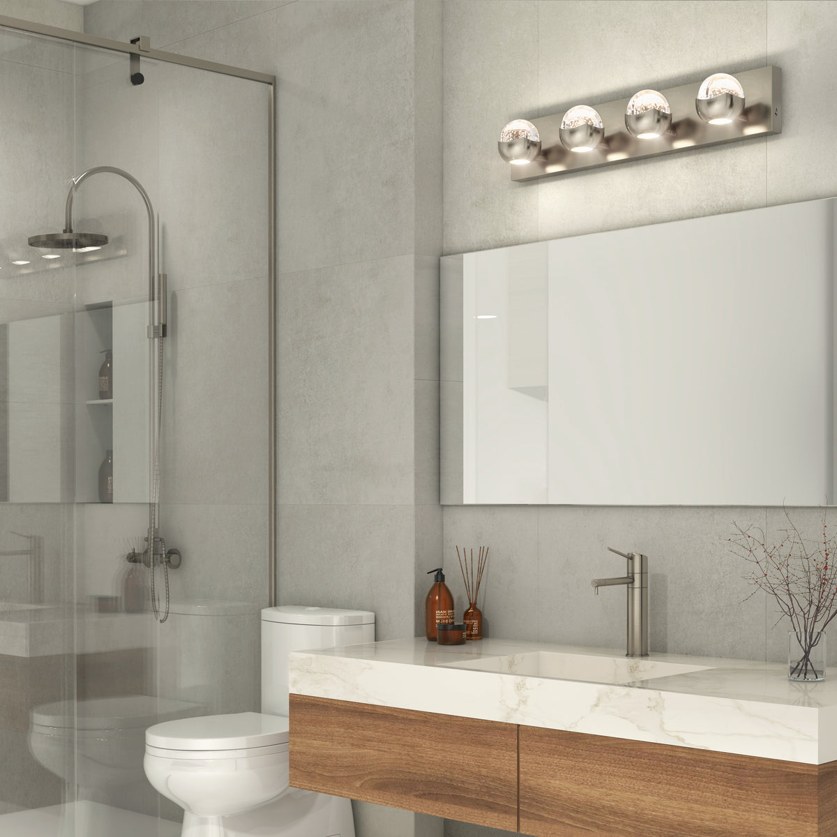 Modern bathroom with a glass shower, white toilet, large mirror, marble countertop, wood vanity, and minimal decor. Four-bulb vanity light fixture is mounted above the mirror.