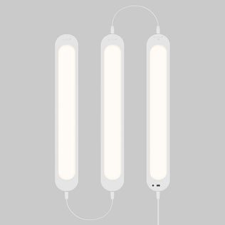 Artika Impulse Under-Cabinet LED Light RGB+CCT, three linked bars glow softly on gray, cables visible, includes remote.
