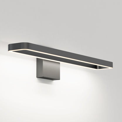 The Artika Hinge LED modern bathroom vanity light features a rectangular matte black frame, square base, and soft white glow, offering minimalist style with 3 CCT options for versatile wall-mounted lighting.