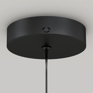 Close-up of the Artika Hanson 1-light LED pendant 5 CCTs black, round ceiling canopy with a smooth finish and a visible side screw, mounted on a white ceiling with its cable hanging from the center.