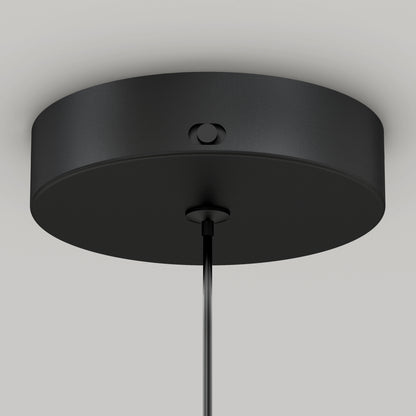 Close-up of the Artika Hanson 1-light LED pendant 5 CCTs black, round ceiling canopy with a smooth finish and a visible side screw, mounted on a white ceiling with its cable hanging from the center.