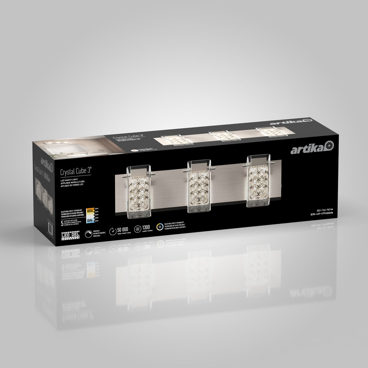 A rectangular box for the Artika Crystal Cube LED bathroom vanity light 5 CCT, showing the mounted fixture with three crystal cube shades on a brushed metal bar, plus product details and Artika branding on the packaging.