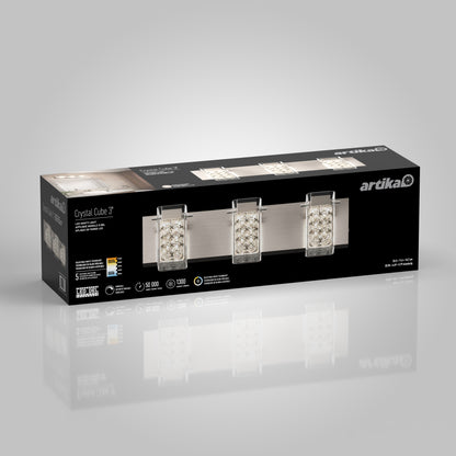 A rectangular box for the Artika Crystal Cube LED bathroom vanity light 5 CCT, showing the mounted fixture with three crystal cube shades on a brushed metal bar, plus product details and Artika branding on the packaging.