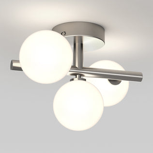 The Artika Bloom LED flush mount features three frosted glass globes and tunable white tech on a modern circular base.