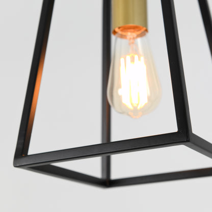 A close-up of the Carter 1-light pendant by Artika shows a glowing Edison-style bulb in a geometric black metal frame against a plain white background.