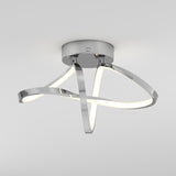 A modern ceiling light fixture with a chrome base and three intertwined, curved LED light strips, creating an abstract, sculptural appearance against a plain white background.