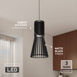 A modern pendant light with a matte black finish hangs from the ceiling in a kitchen. Labels highlight its energy efficiency, integrated LED, and a 3-year warranty.