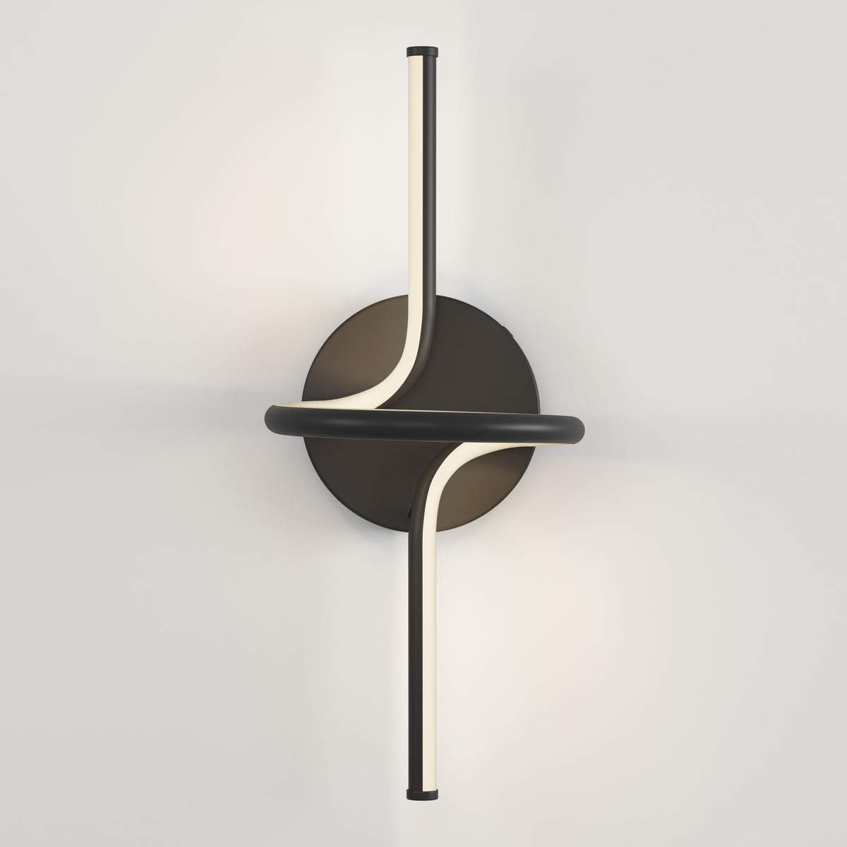 A modern black wall sconce with two curved, illuminated light bars crossing over a circular base, mounted on a white wall.