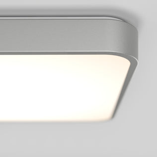 A close-up of the Artika Europa 18 in. LED flush mount light, featuring a modern rectangular design with rounded edges, sleek metallic frame, and soft white glow. Includes remote control for convenient operation.