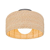 A woven rattan ceiling light fixture with a cylindrical shape and open bottom, showcasing a natural, textured pattern.