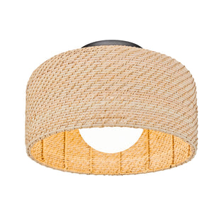 The Emiko modern LED flush mount light 5 CCT by Artika features a woven, cylindrical rattan design with an open bottom and is attached to a black circular base.