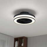 A modern ceiling fan with integrated circular LED lights is mounted on a white ceiling in a minimalistic room with a bookshelf, sheer curtains, and vertical wall paneling.